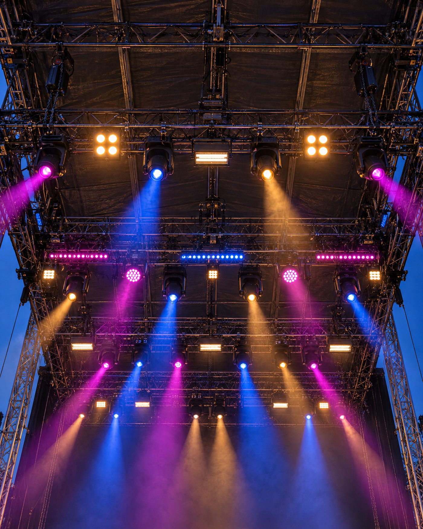 The lighting rig and truss over the stage, lit